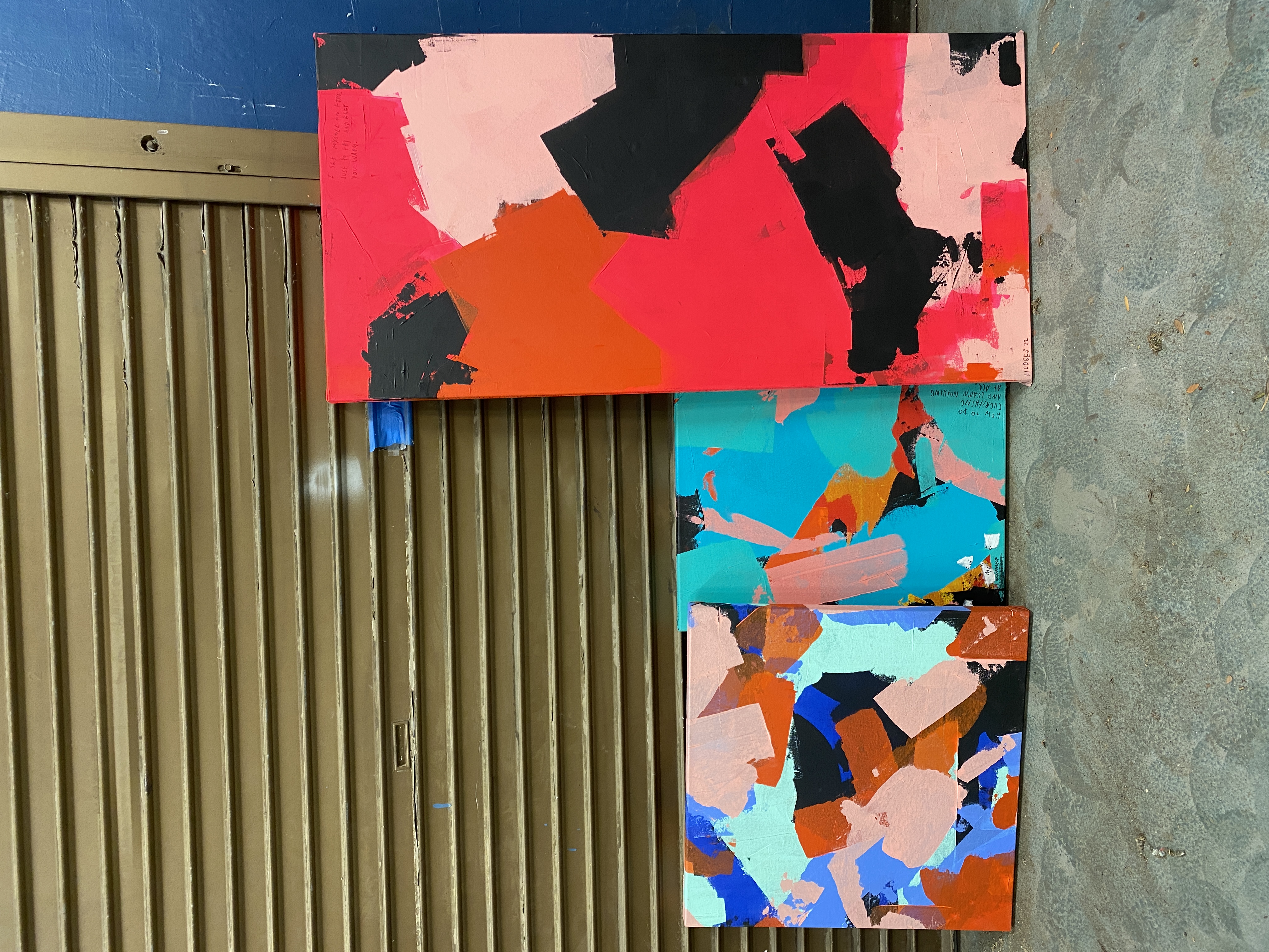 Abstract canvas — bold red, coral, pink, and black geometric forms